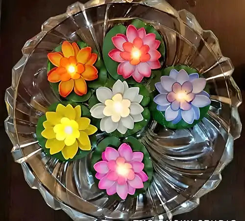 Six flameless lotus flower water sensor LED diyas for Diwali decorations, featuring LED lights and water-resistant design.