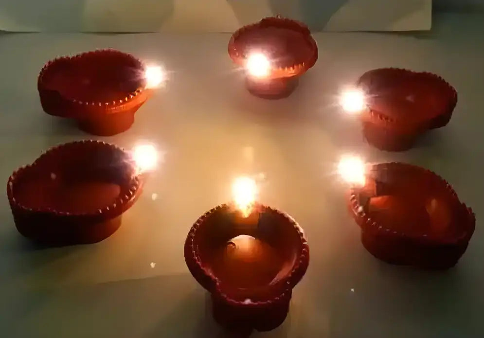 Set of six LED brown diyas with water sensors for Diwali decorations, featuring traditional Indian design and lighting.