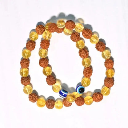 Pair of Rudraksha Citrine Crystal bracelets for prayer and meditation, featuring natural beads and sacred stone accents.