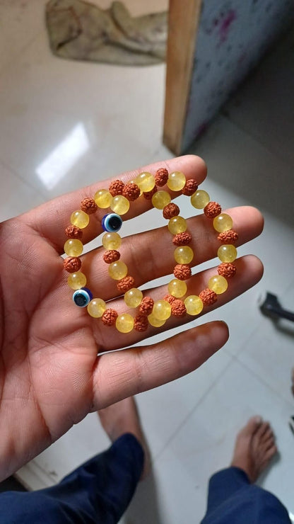 Two Rudraksha and citrine crystal bracelet set for spiritual pooja, featuring natural beads on elastic bands.