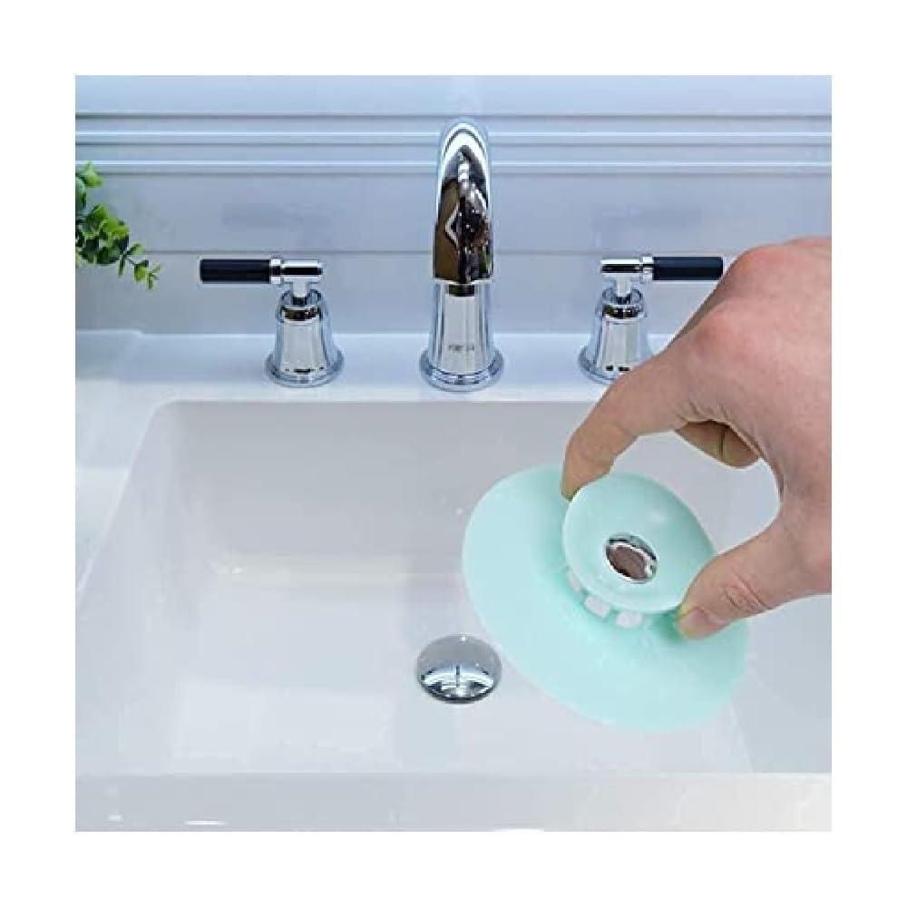 Set of three silicone kitchen sink strainers in random colors, ideal for preventing clogs in household kitchen sinks.