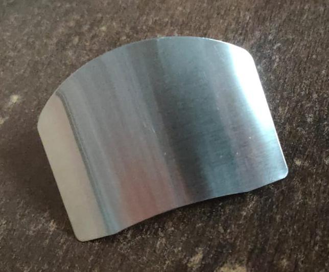 Stainless steel finger cutting protector hand from 19378 kitchen tool set, designed to safeguard fingers while slicing or chopping.