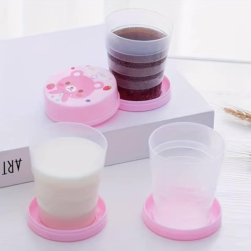 Portable plastic telescopic folding cups for outdoor travel, camping, and picnics, shown in a set of two.