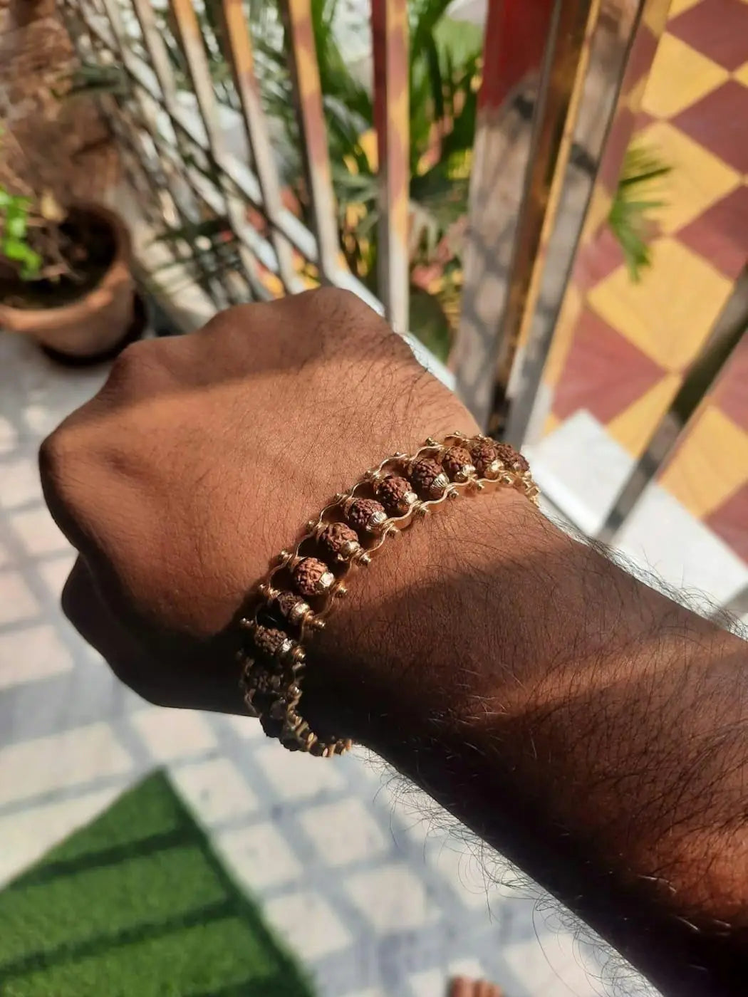 Genuine Paanch Mukhi Rudraksha bracelet with gold plating, modern design, shown in a pack of two for spiritual and decorative use.