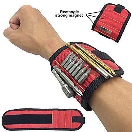 Magnetic wrist band for holding small metal accessories and tools, ideal for power tool users, shown on a person's wrist.