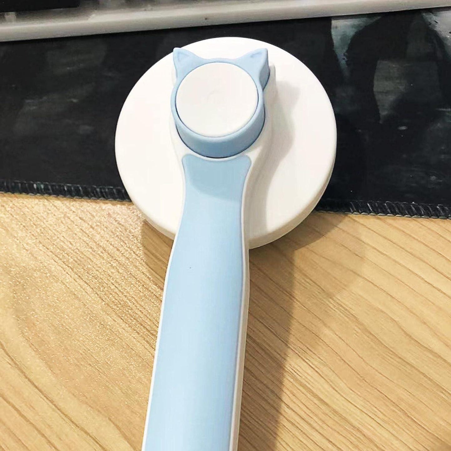 Pet hair removal brush by 19378, featuring a handle and bristles designed to effectively remove pet hair from furniture and clothing.