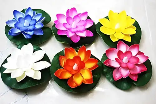 Set of six flameless lotus flower water sensor LED Diyas for Diwali decorations, featuring realistic flower designs and soft lighting.