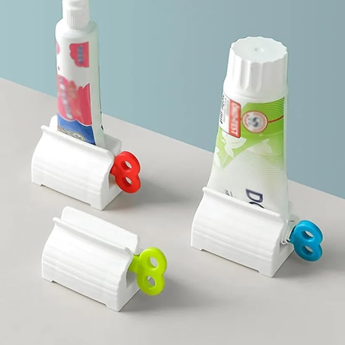 Set of four 19357 portable toothpaste dispensers, manual squeeze tubes for bathroom use, compact and easy to operate.