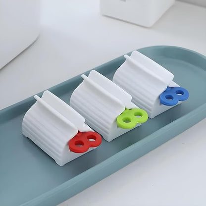 Set of four portable toothpaste dispensers by 19357, manual squeeze tubes for bathroom use, compact and easy to operate.