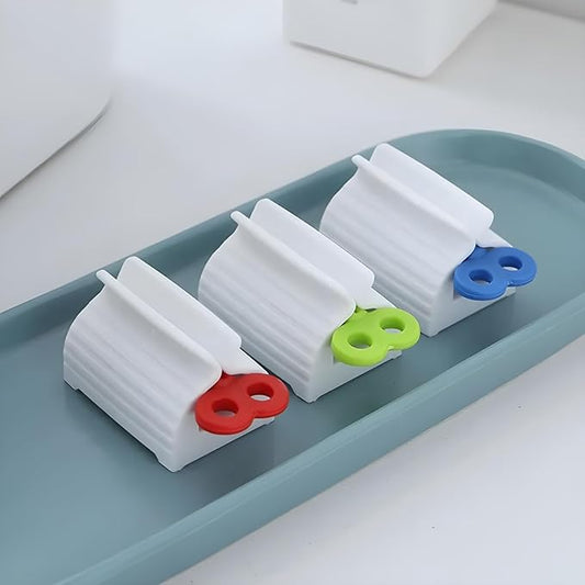 Set of four portable toothpaste dispensers by 19357, manual squeeze tubes for bathroom use, compact and easy to operate.