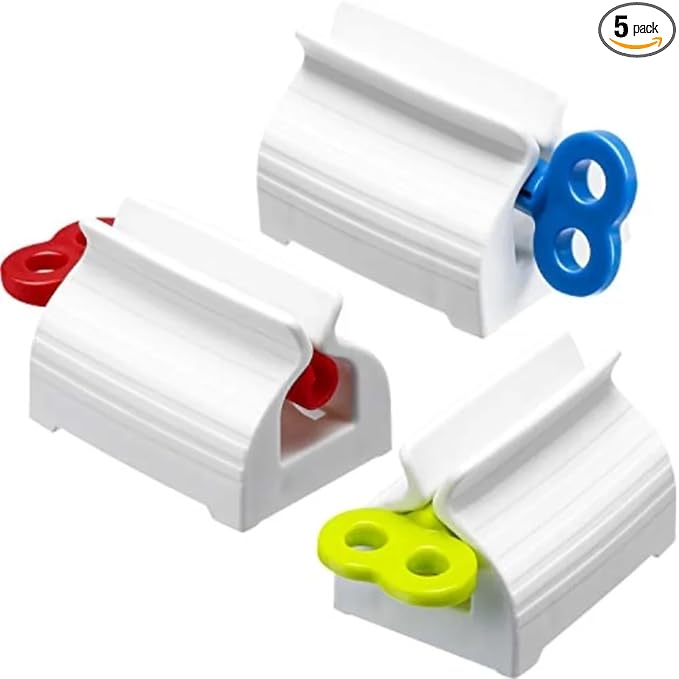 Set of four portable manual toothpaste dispensers with rolling squeeze press machines for bathroom use.