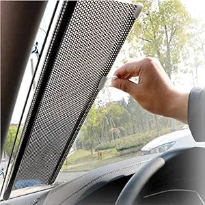 Universal fit magnetic car side window privacy sunshade curtain installed on vehicle window showing the fabric and magnetic edges.