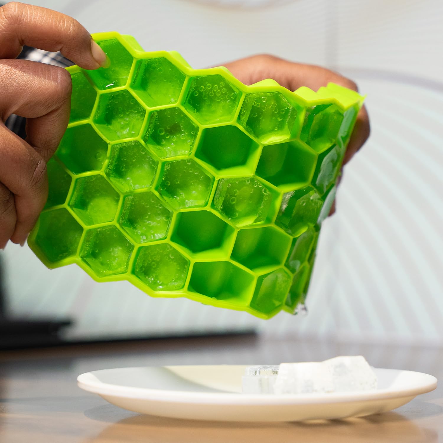 Two Kitchen4U silicone ice cube trays with 37 small honeycomb-shaped ice molds for whiskey, cocktails, and freezing in the fridge.