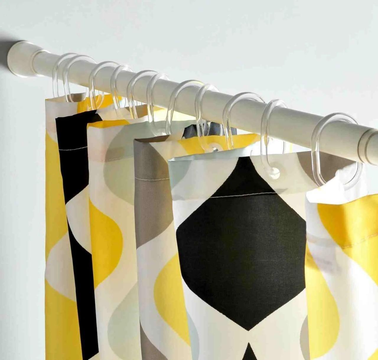 Adjustable drill-free curtain rod from 25560 with mounting brackets, suitable for versatile home window dressing.
