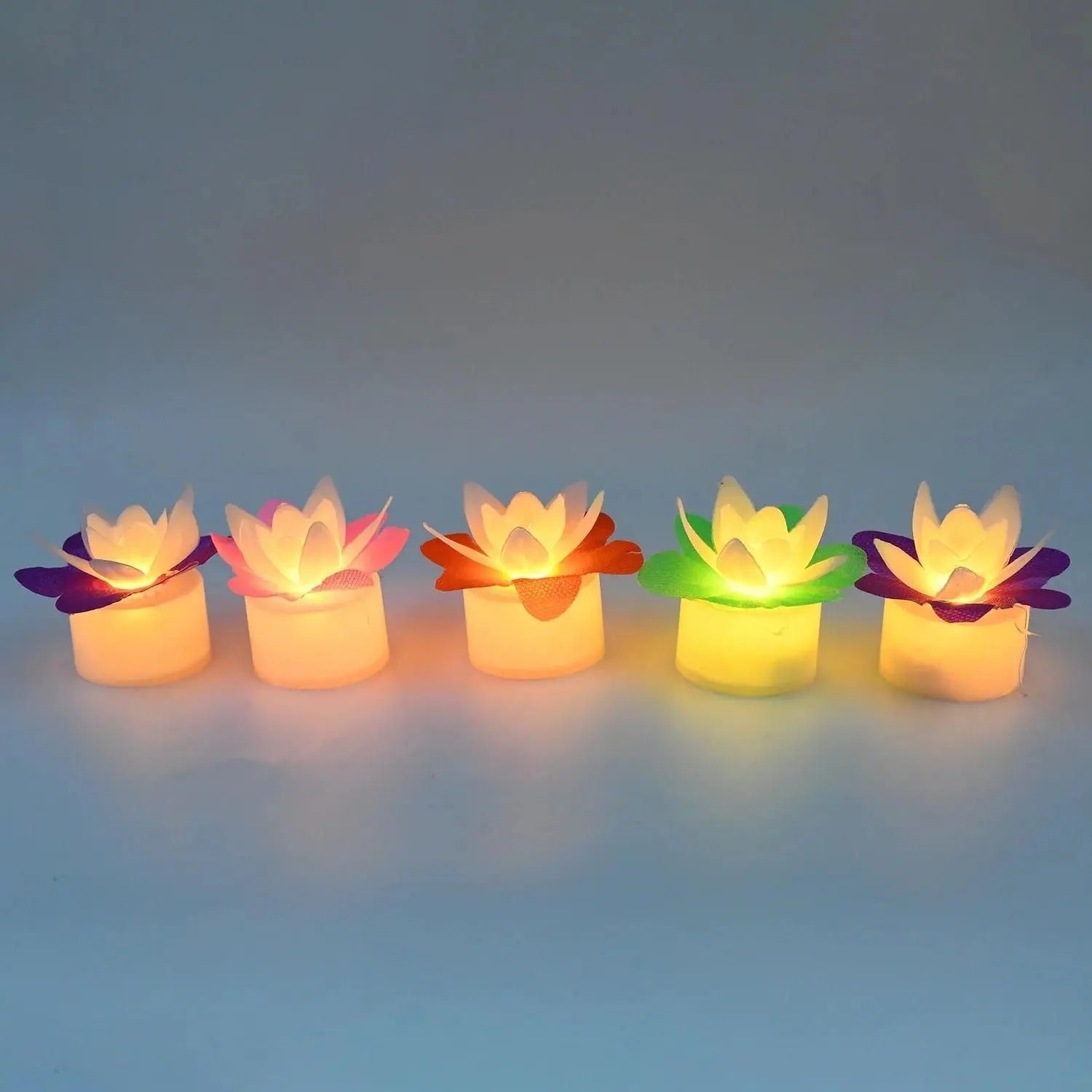 Set of four red and pink LED lotus flower candles for Diwali decoration, featuring decorative candle design by 18051.