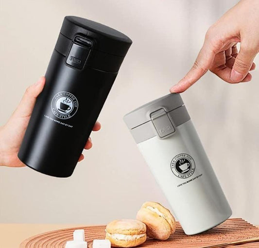 Stainless steel 380ml vacuum tumbler and coffee mug by 18052, featuring a sleek design for hot and cold beverages.