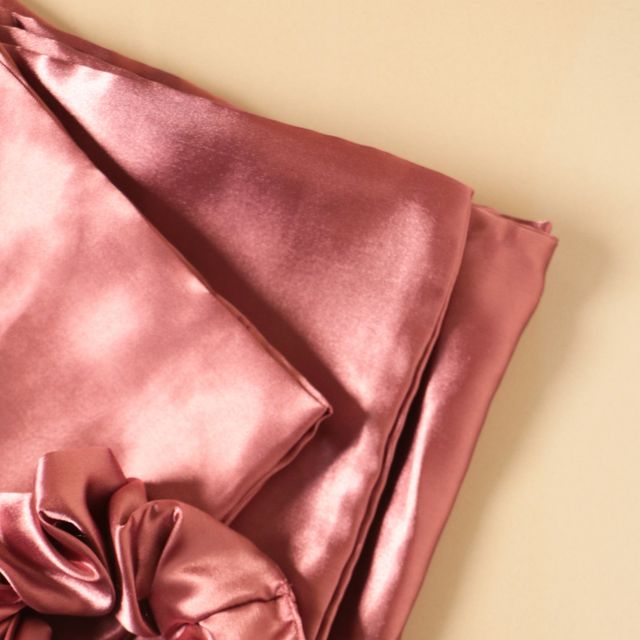 Soft satin pillowcase from 18214 pillow covers, showing a smooth, shiny fabric in a close-up view.
