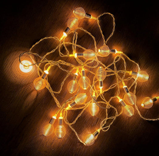 Spring Light 14 LED golden circular metal ball shape Diwali lights, warm white decorative string for festivals and celebrations.