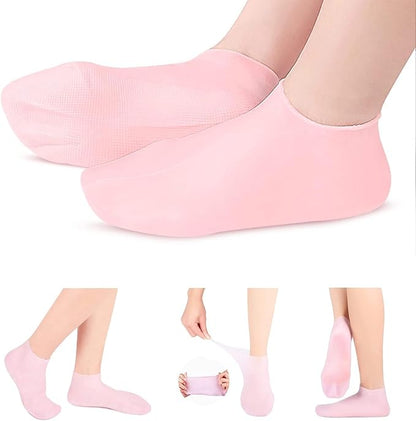Pink moisturizing silicone spa gel socks for women and men, designed to soothe dry, cracked heels and remove calluses with Vitamin E.