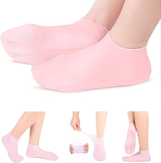 Pink moisturizing silicone spa gel socks for women and men, designed to soothe dry, cracked heels and remove calluses with Vitamin E.