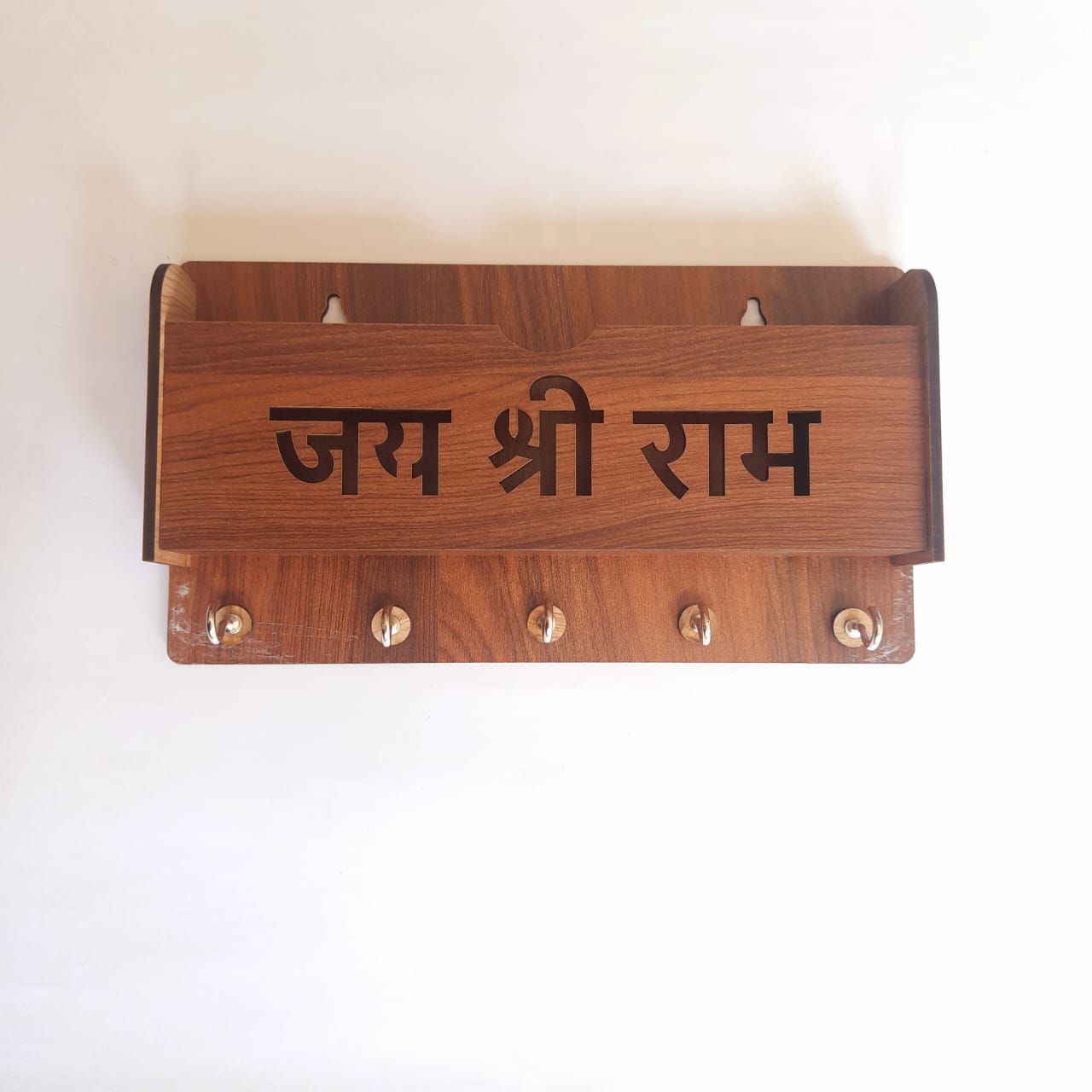 Brown wooden Jay Shree Ram phone stand and keyholder with carved Ram figure, compact and decorative for home or desk use.