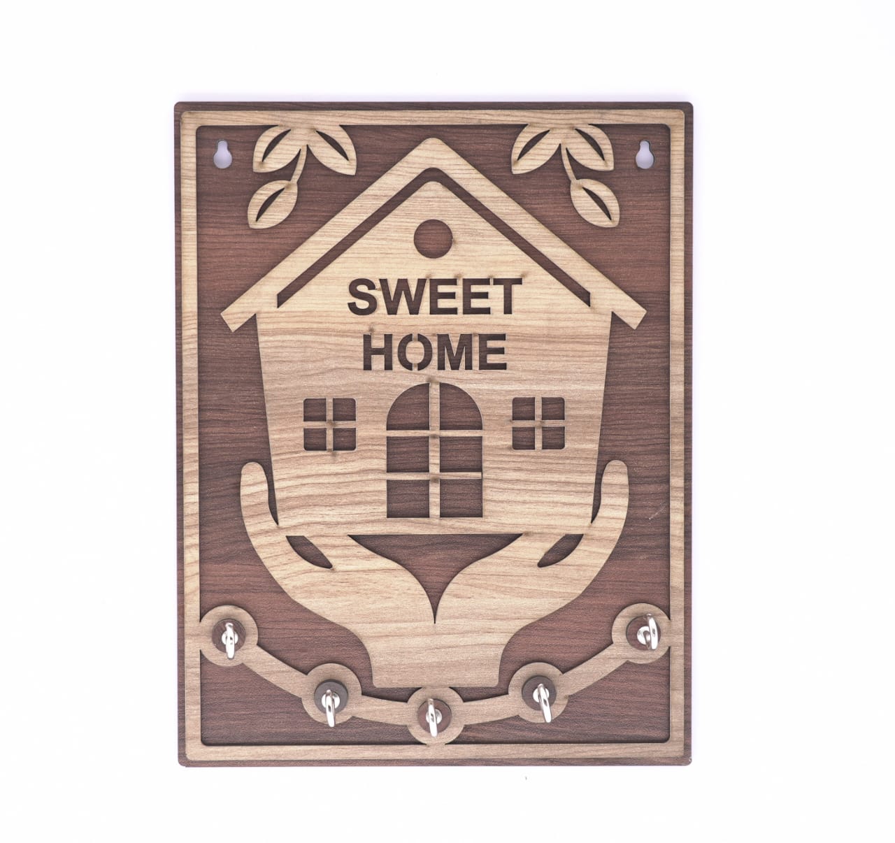 Brown wooden keyholder with "Sweet Home" inscription and hand-shaped hooks, designed for organizing keys in a cozy home.
