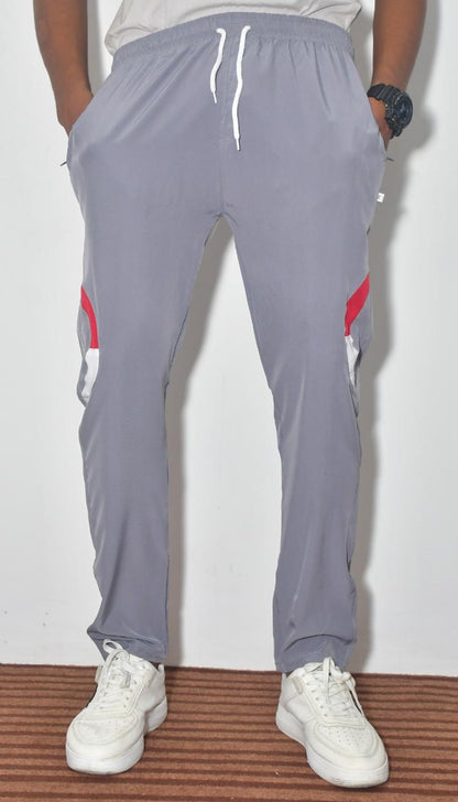 Multicolor boys' track pants from 18359 featuring solid and striped design, comfortable joggers for boys.