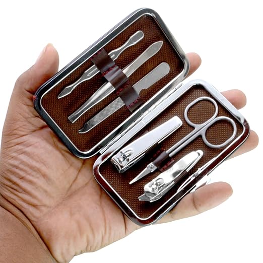 Silver SJ 6-in-1 nail art clipper and manicure tool set with tweezers, ear pick, and cutter for pedicure and manicure.