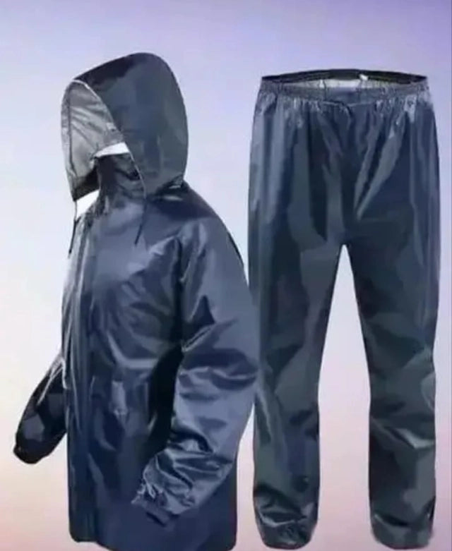 Black men's polyester solid rainsuit, XL size raincoat with hood, designed for waterproof protection and outdoor weather.