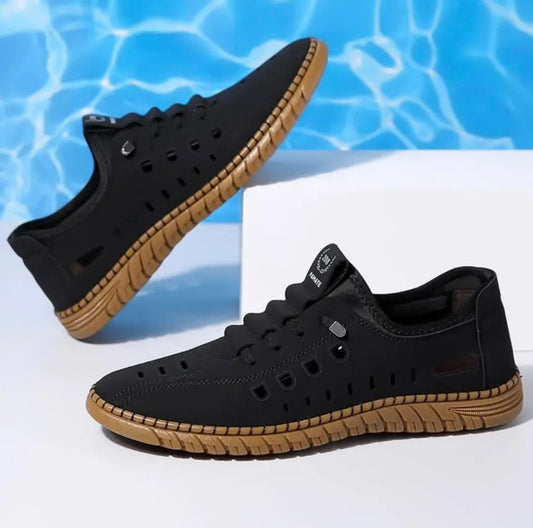Men's stylish laser cut casual shoes in black with intricate cut-out details, designed for comfort and modern fashion.