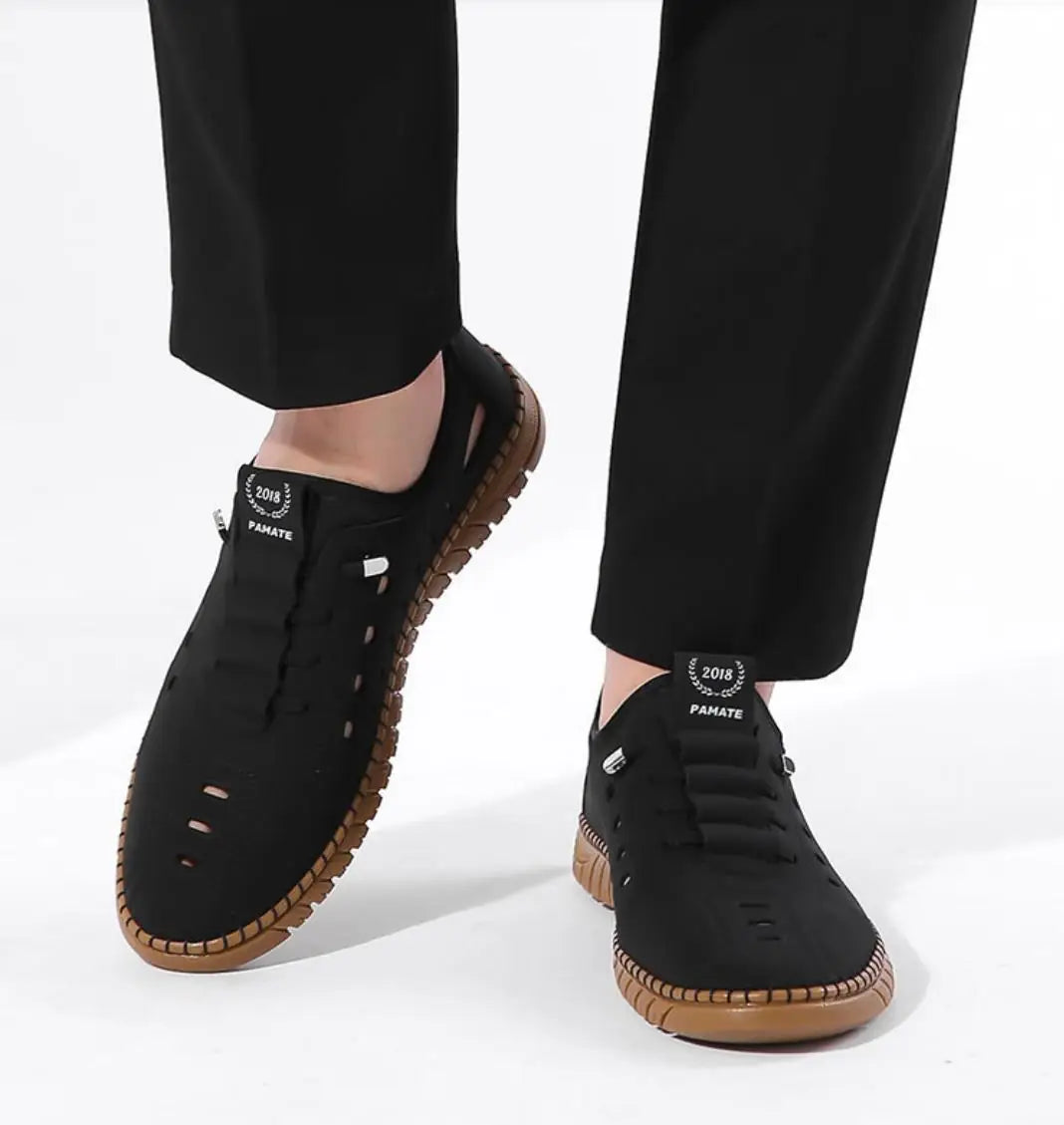 Men's stylish laser cut casual shoes in black with breathable design and comfortable sole, by brand 18644.