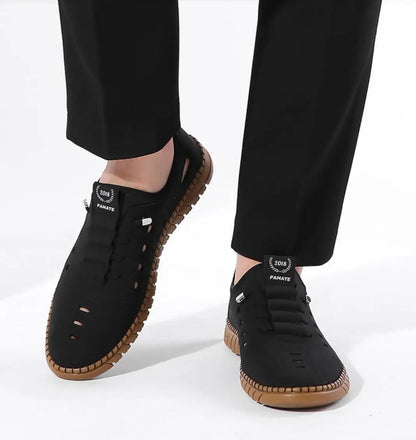 Men's stylish laser cut casual shoes in black with breathable design and comfortable sole, by brand 18644.