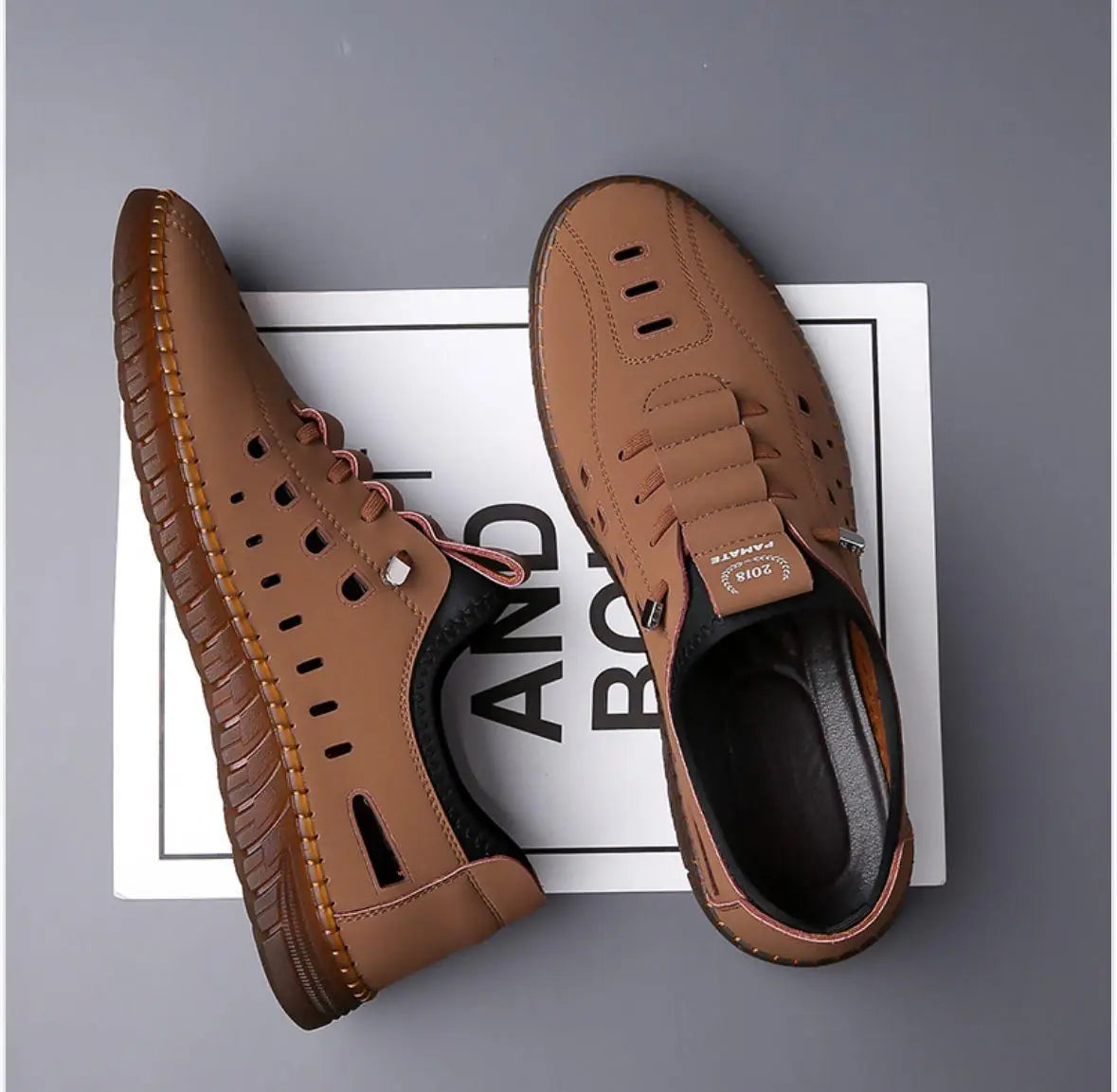 Men's stylish laser cut tan casual shoes with a sleek design and breathable cutouts, featuring brand 18644.