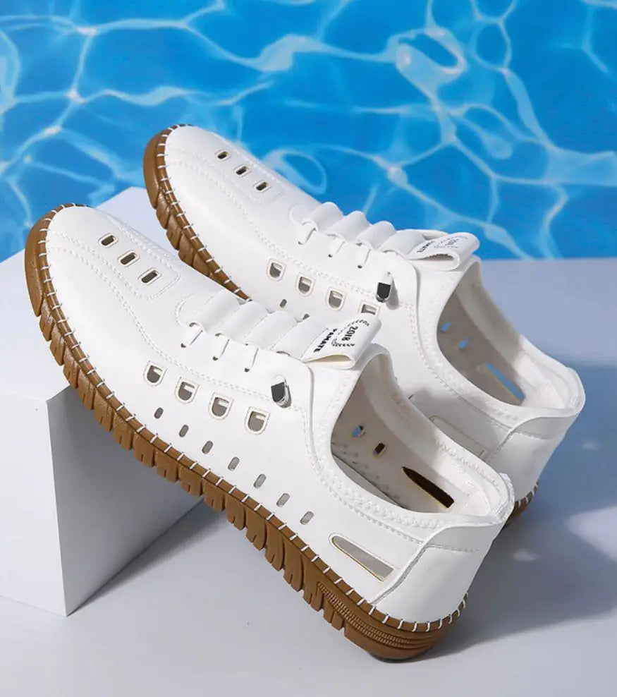 Men's stylish laser-cut white casual shoes with intricate cutout designs, made by 18644, showcasing a modern and fashionable look.