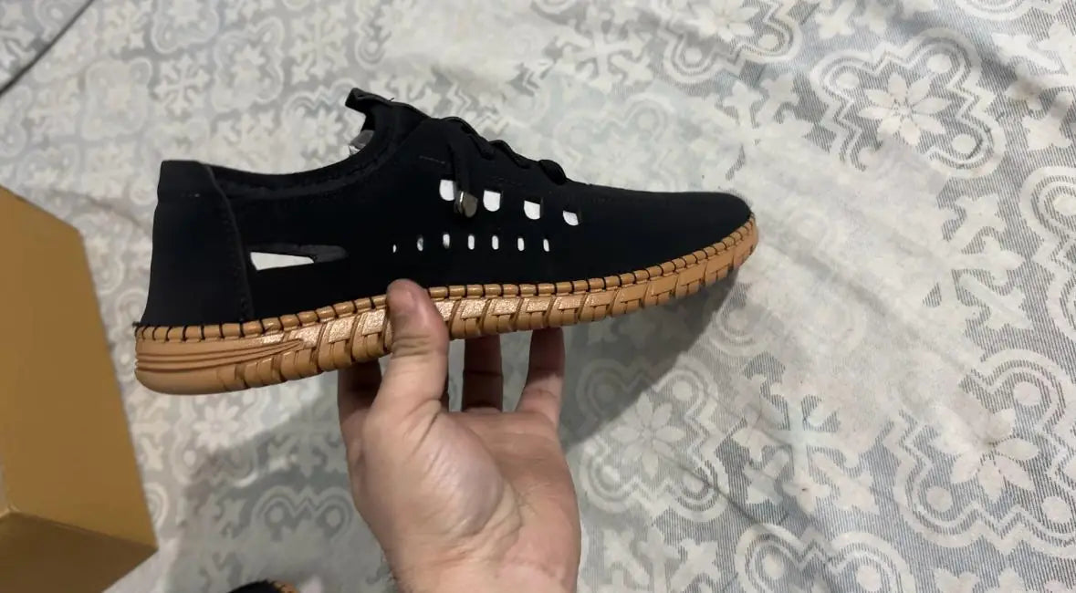 Men's white casual shoes with stylish laser cut design, 18644 brand, featuring comfortable slip-on style and modern casual look.