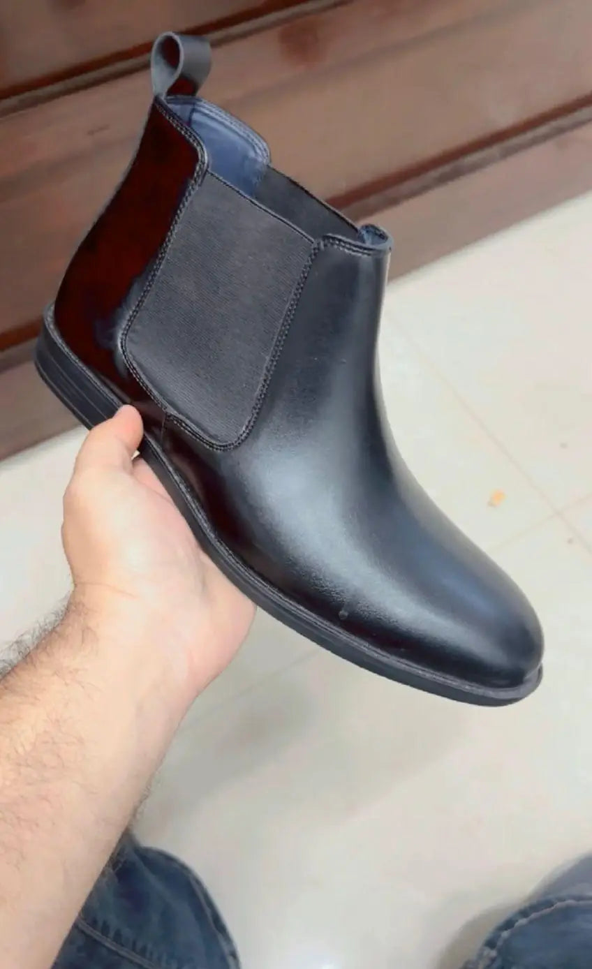 Men's casual synthetic boots from 18644, showing black slip-on shoes with rugged sole and sleek design.