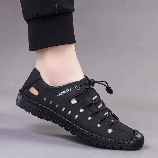 Men's stylish casual shoes in black leather with white rubber soles, designed for comfort and everyday wear.