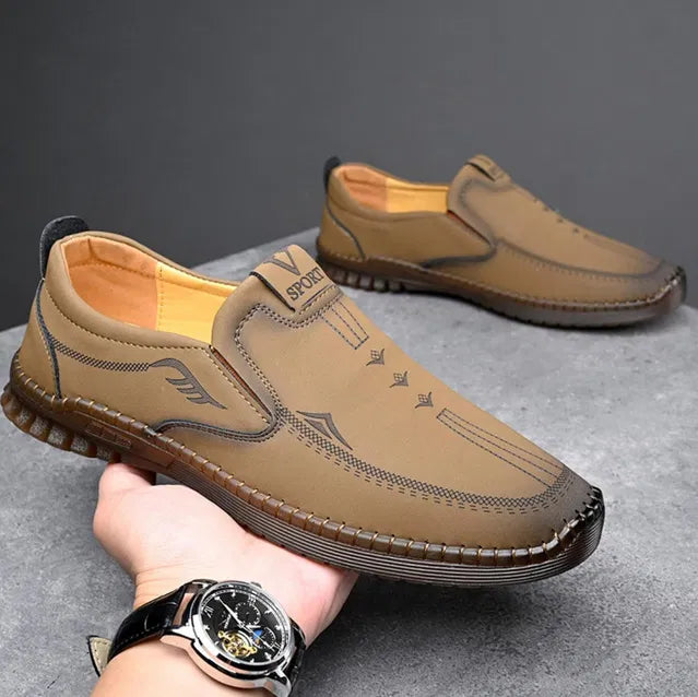 Brown men's casual shoes with laser-cut leather design from brand 18644, showcasing stylish and comfortable footwear.
