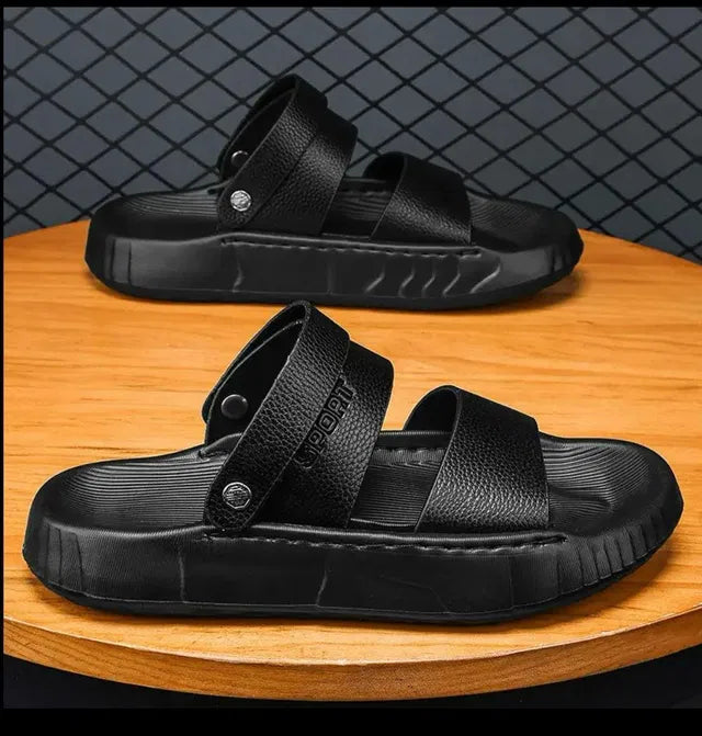 Black men's sandal by 18644 featuring open-toe design and adjustable straps, perfect for casual summer wear.