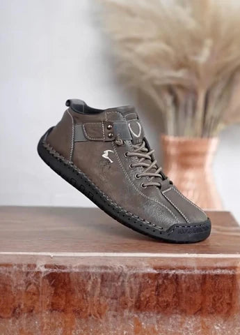 Men's brown casual boots by 18894, showcasing stylish leather footwear with a rounded toe and sturdy sole.