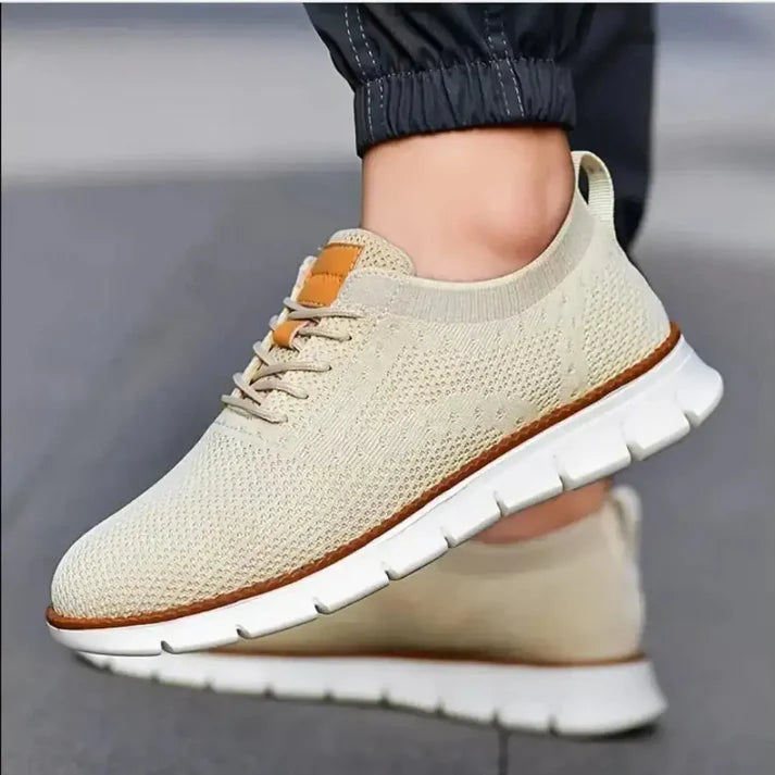 Tan mesh men's casual shoes by 18894, featuring breathable fabric and a comfortable slip-on design.