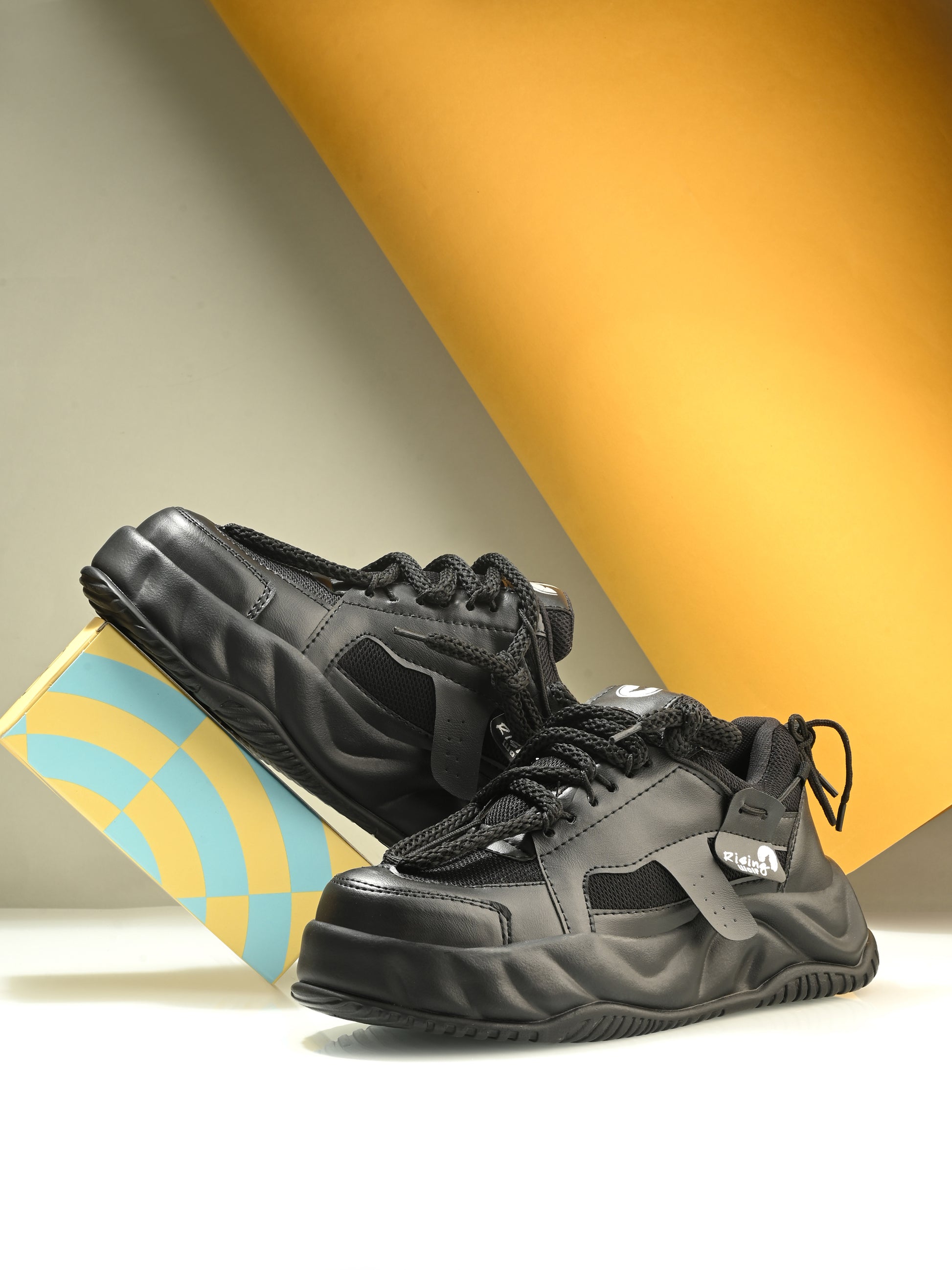 Mens black sport shoes by 18894 with breathable mesh design and cushioned soles for athletic activities.