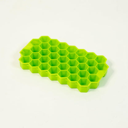 Kitchen4U silicone ice cube tray with 37 small, honeycomb-shaped ice cubes for whiskey and cocktails, flexible and easy to release.