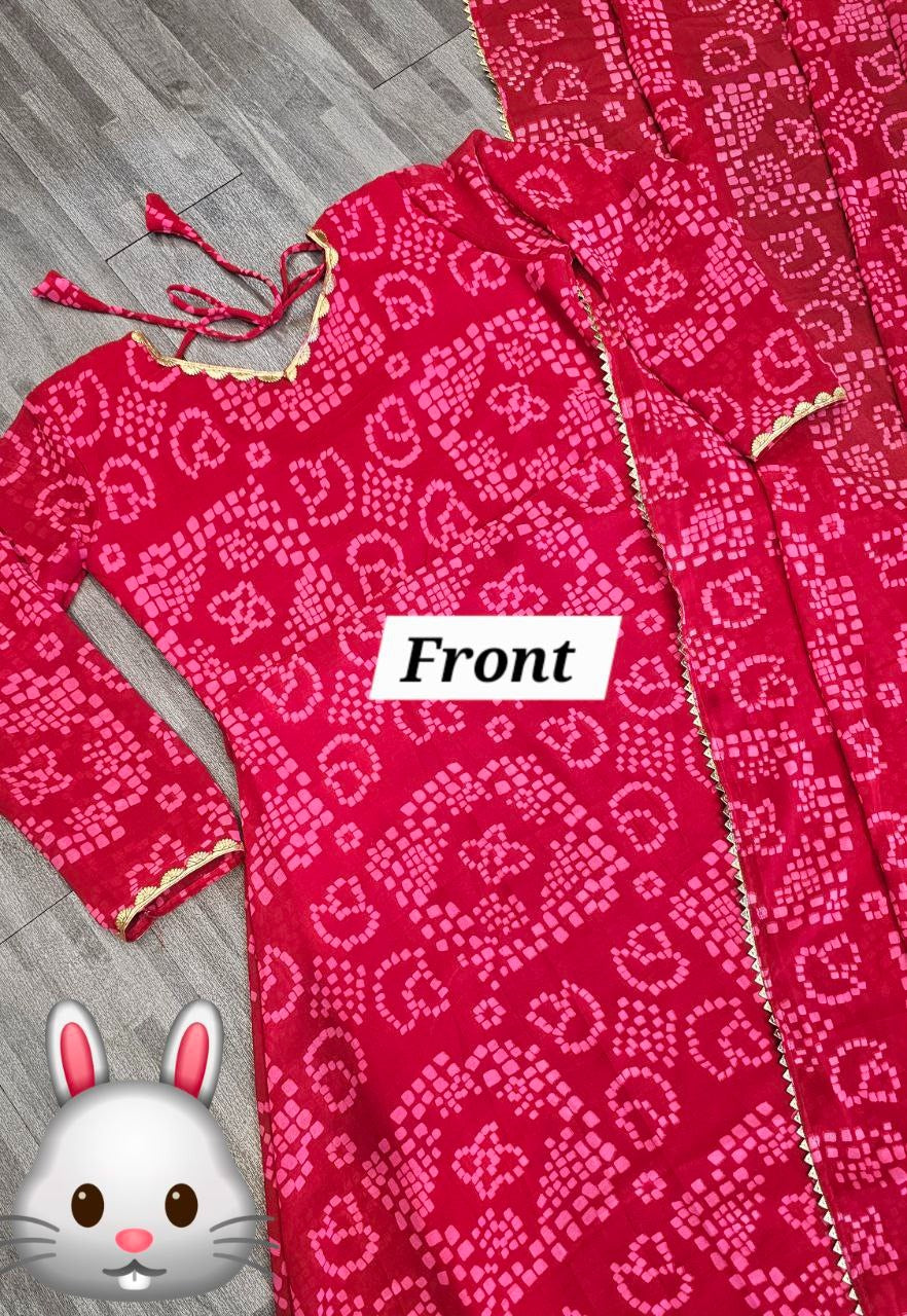 Women’s red Bandhani styles gown by 19198, featuring traditional Indian print, long sleeves, and flowing silhouette.