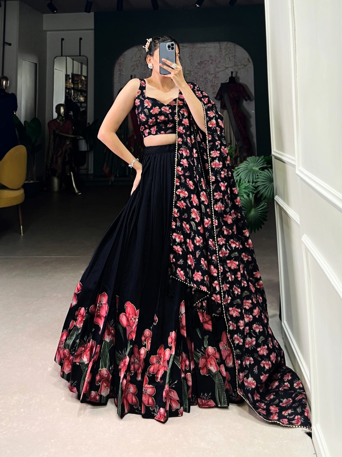Black women's Lehenga Choli with traditional and sparkly design, featuring intricate embroidery and fabric details.