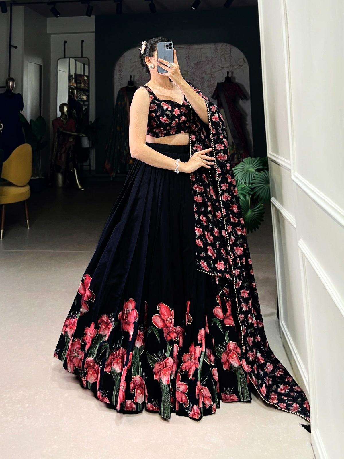 Black women's Lehenga Choli with traditional and sparkling design, featuring intricate embroidery and elegant fabric details.