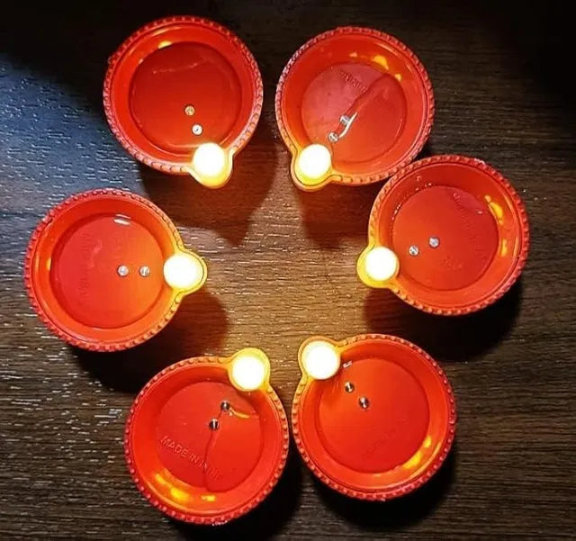 Water sensor LED Diya light from 19357, flameless and smokeless, warm ambient eco-friendly LED candles for Diwali and home decoration.