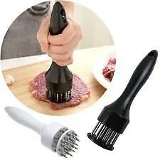 Stainless steel meat tenderizer with needle prongs, part of a kitchen tool set, designed for tenderizing meats effectively.