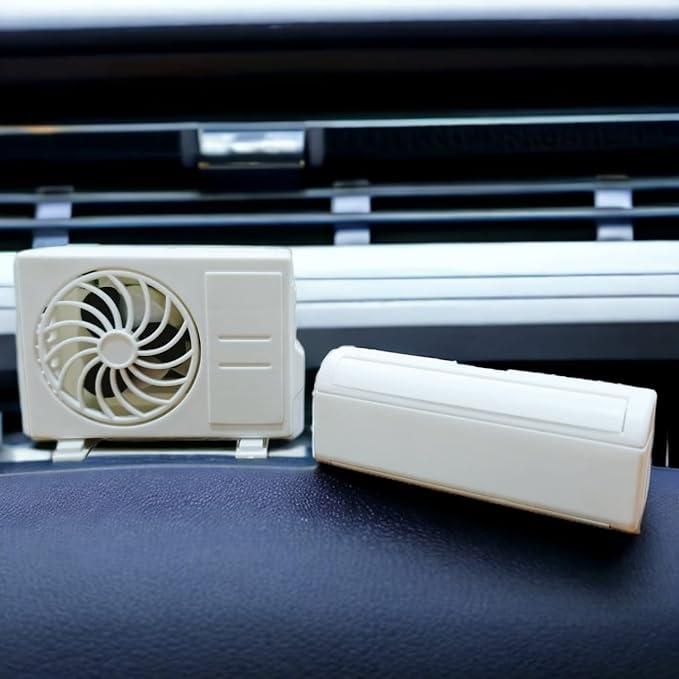 Miniature AC design solar-powered car air freshener diffuser from 19378, compact electric grooming accessory with freshening function.