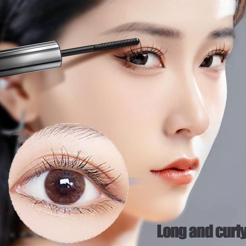 Close-up of 19378 Iron Brush Mascara eye serum applicator showing brush and serum texture on the eye area.